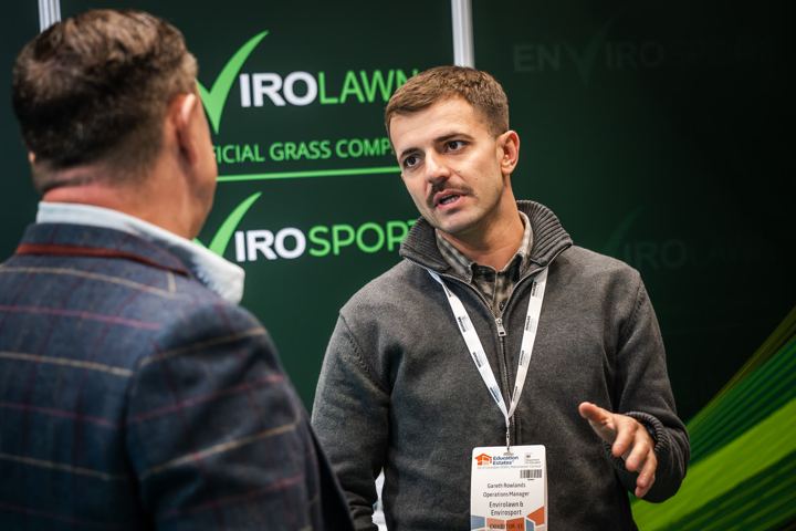 Talking to a visitor on the stand