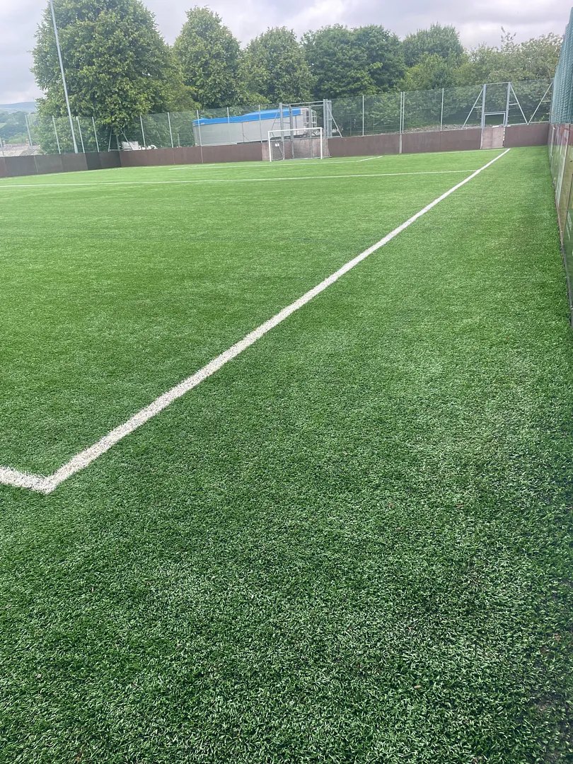 A 3G pitch freshly groomed after a maintenance visit